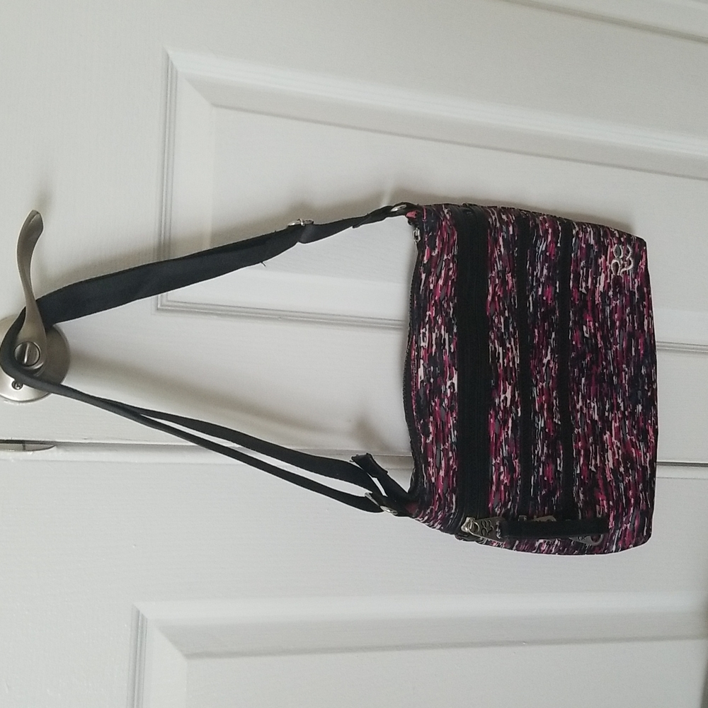 Rare Earth crossbody bag with adjustable strap.